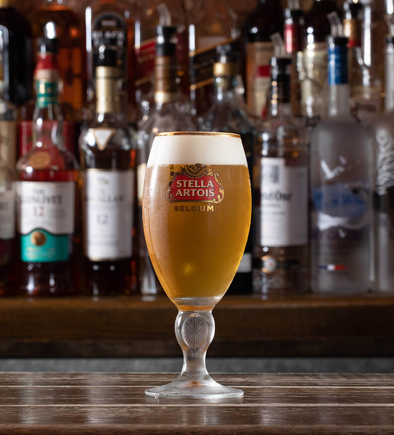 a glass of stella beer